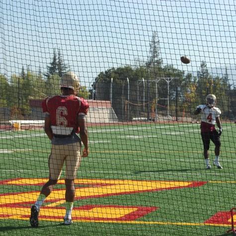 De Anza Quarterback Ron Johnson loosens his arm before practice. Johnson threw for 254 yards, four touchdowns and one interception against Laney on Saturday Oct. 3.