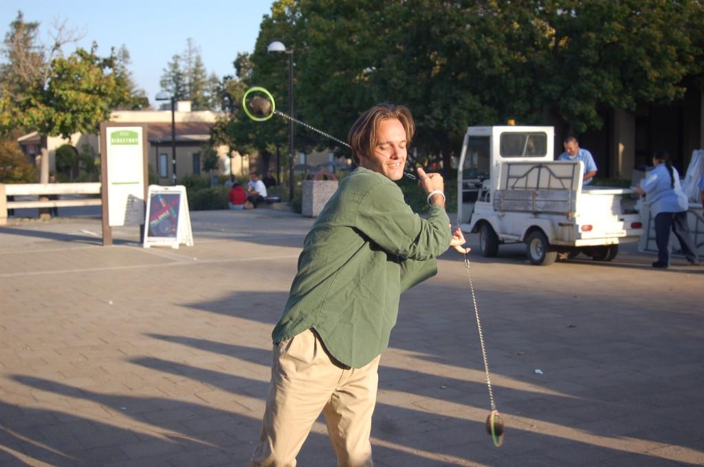 Student and former Senate President Robin Claassen shows how to twirl poi during the Fall Day of Action demonstration in the Main Quad Oct. 7.