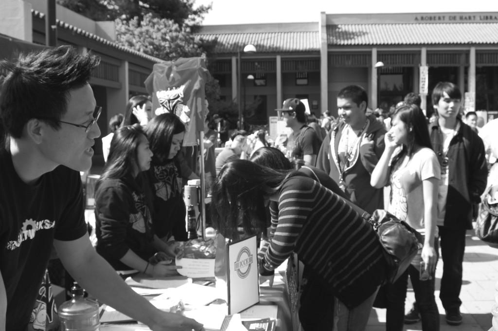 De Anza students get information as they walk from table to table during the annual Club Day event held in the Main Quad.