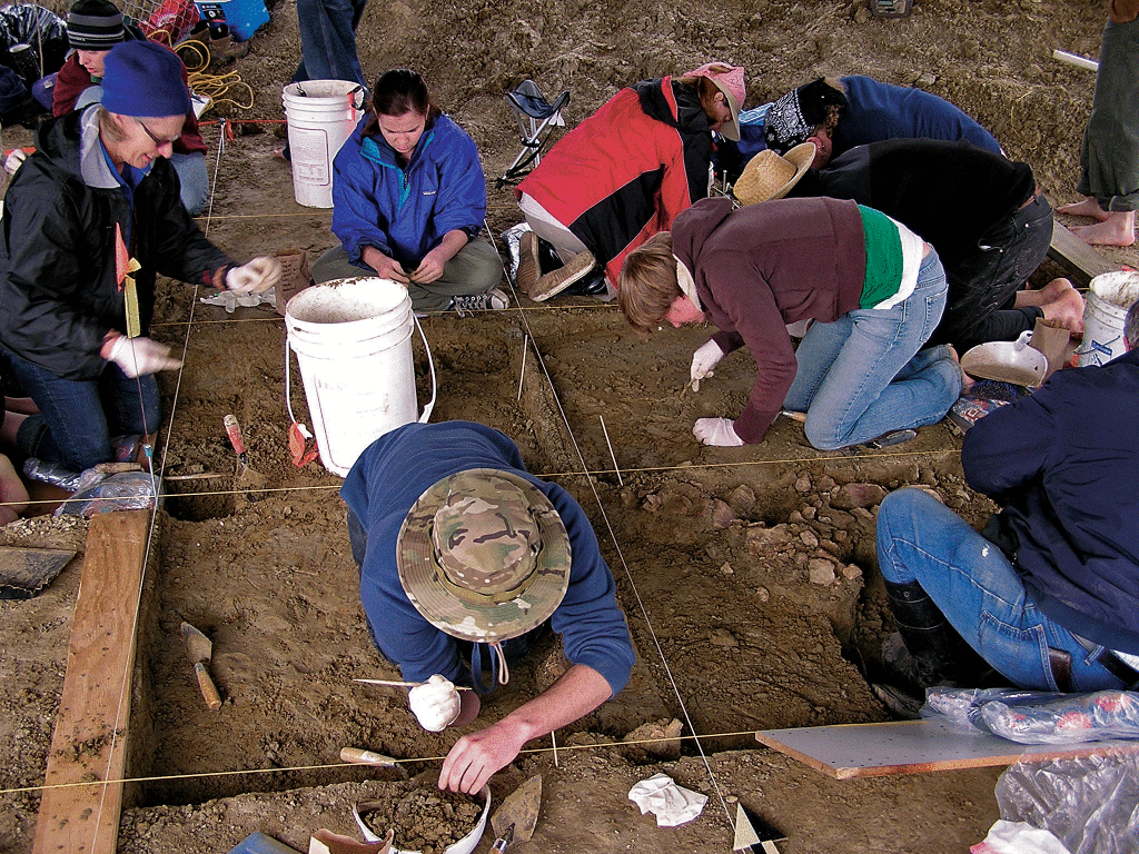 DIGGING - Scientists and students meticulously examine the dirt to look for small mammoth fragments from thousands of years ago.