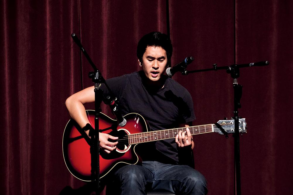 STRUMMIN - Jeremy Ladicho strums on his acoustic guitar singing a medley of original songs. Even through a microphone malfunctioned, his voice resounded throughout the Visual and Performing Arts Center.