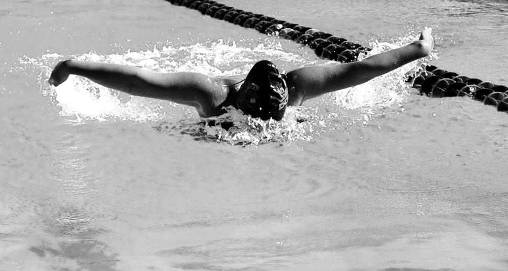 DOLPHIN+KICK+-+Sophomore+Victoria+Santos+competes+in+the+50-yard+butterfly+at+Ohlone+College+during+the+Coast+Conference+Championships+April+22.+She+ultimately+took+fifth+place+helping+De+Anza%E2%80%99s+Women%E2%80%99s+Swim+team+finish+8th.