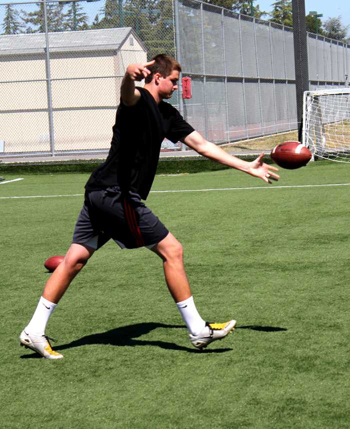 POWER PUNT - High school student Travis Pardula practices out on the De Anza soccer field during team practice May 12.