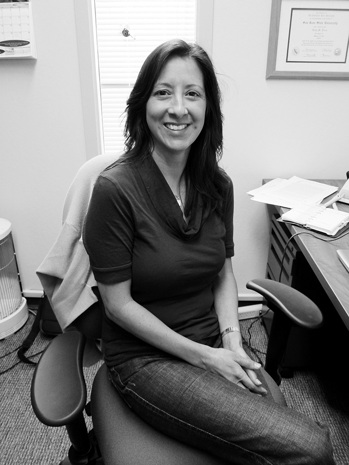 AT THE OFFICE - Kathy Flores, ESL instructor, takes a break from her sabbatical. She is using the time to improve and refine her successful teaching style.