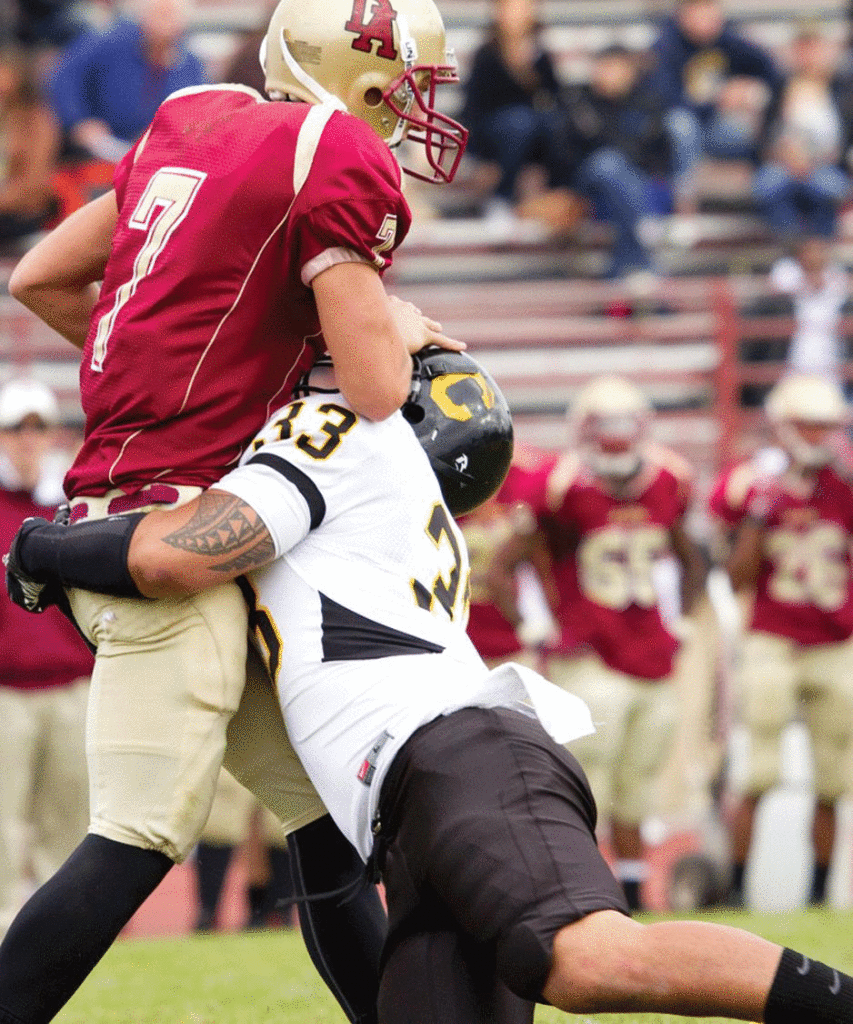 OPPOSITION - Chabot's A.J. McShane tries to take down De Anza quarterback Nick Marra during the game Nov. 12.