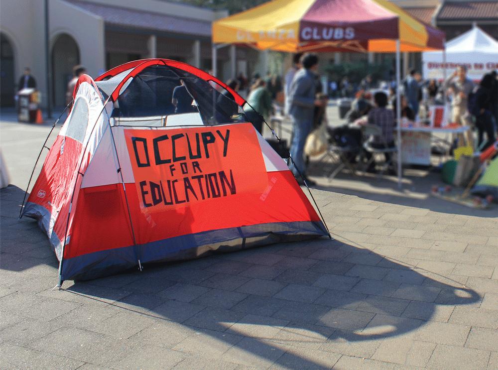 CAMPIN’ OUT - “Occupy for Education at De Anza” began its series of demonstrations in the main quad on Tuesday January 10. Student Luis Flores, 20, has pitched his tent in the center of the quad with a banner that reads ‘OCCUPY FOR EDUCATION’ to draw curiosity from passersby. The group plans to hold weekly campouts to reach out to students and create a dialogue about budget issues to De Anza students.