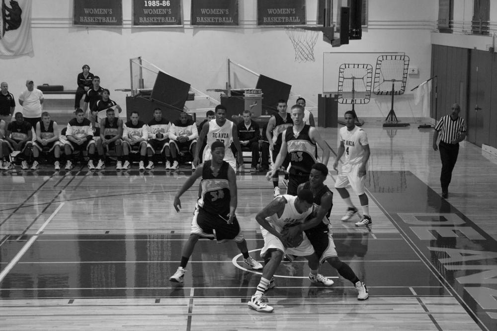 ATTACK - Don Washington attempts to keep possession of the ball after getting the rebound.