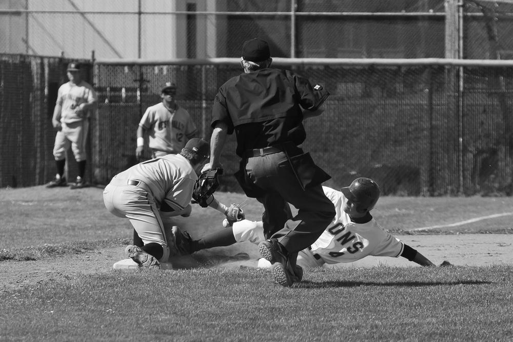 SAFE! - De Anza’s Chris Grawohl slides into third as a result of Vikings Marshall McKinnon’s error in losing the ball.