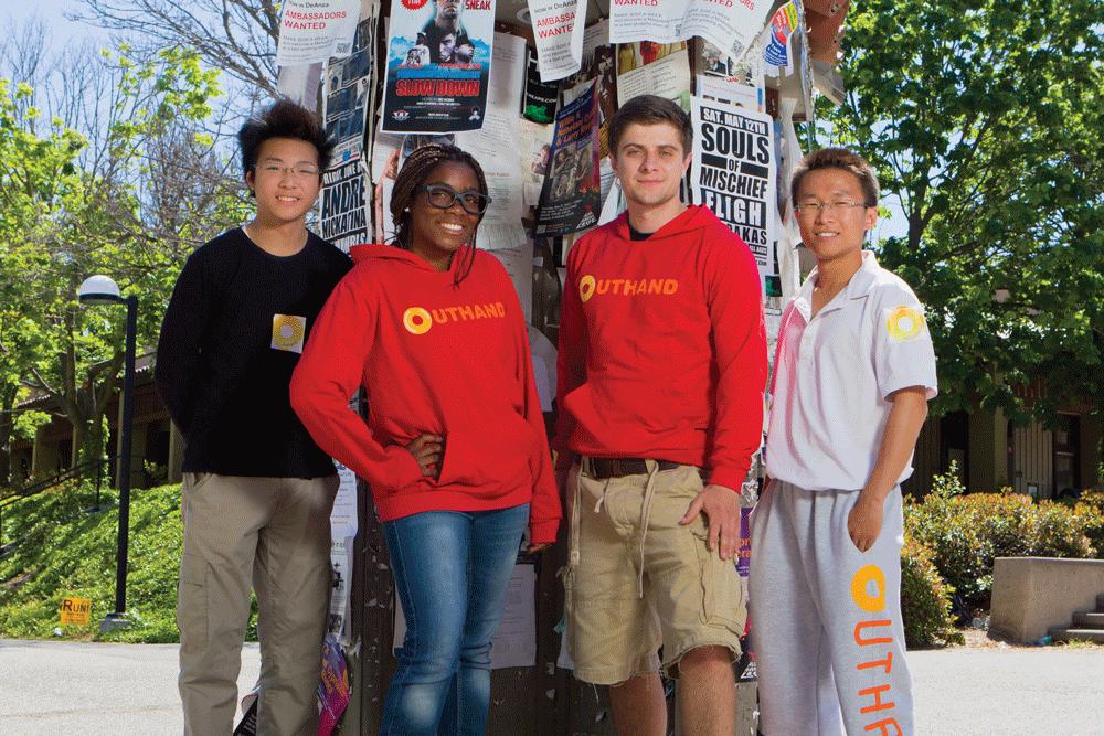 THE CREW - (From left) Ian Lai, 19, Cynthia Ouandji, 17, Alex Claydon, 21, and founder James Zhao, 21, representing Outhand outside De Anza’s Campus Center.