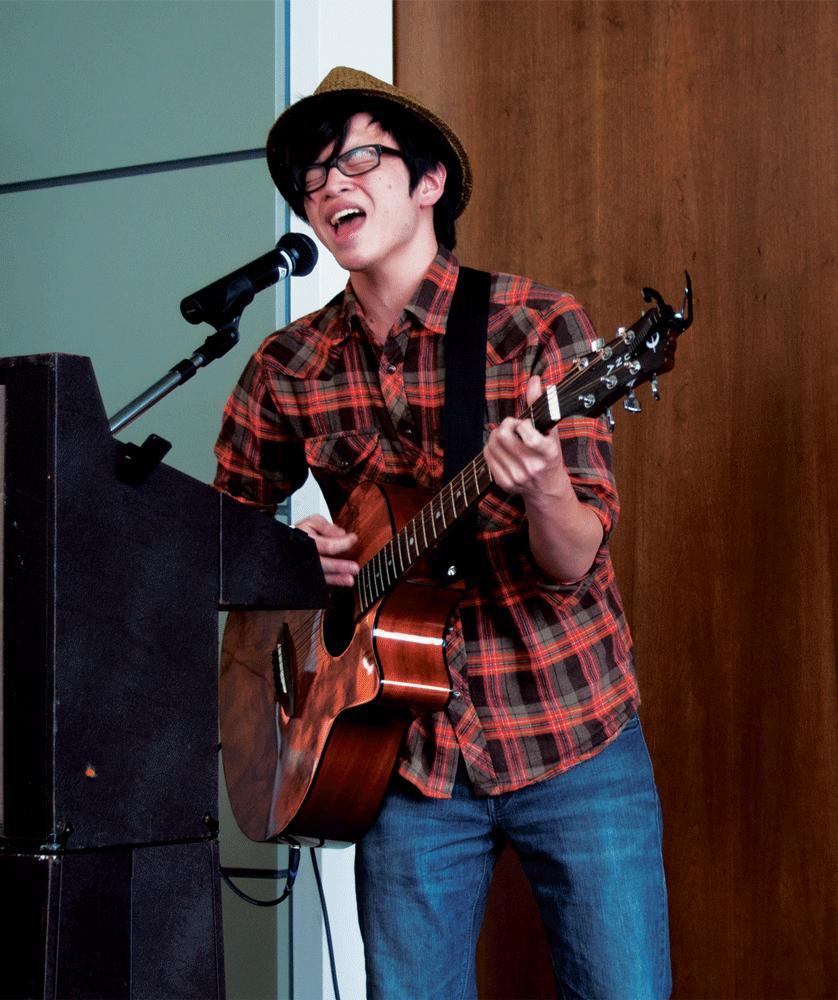 SING IT! - William Wang, 18, advertising major, croons tunes into the microphone. 