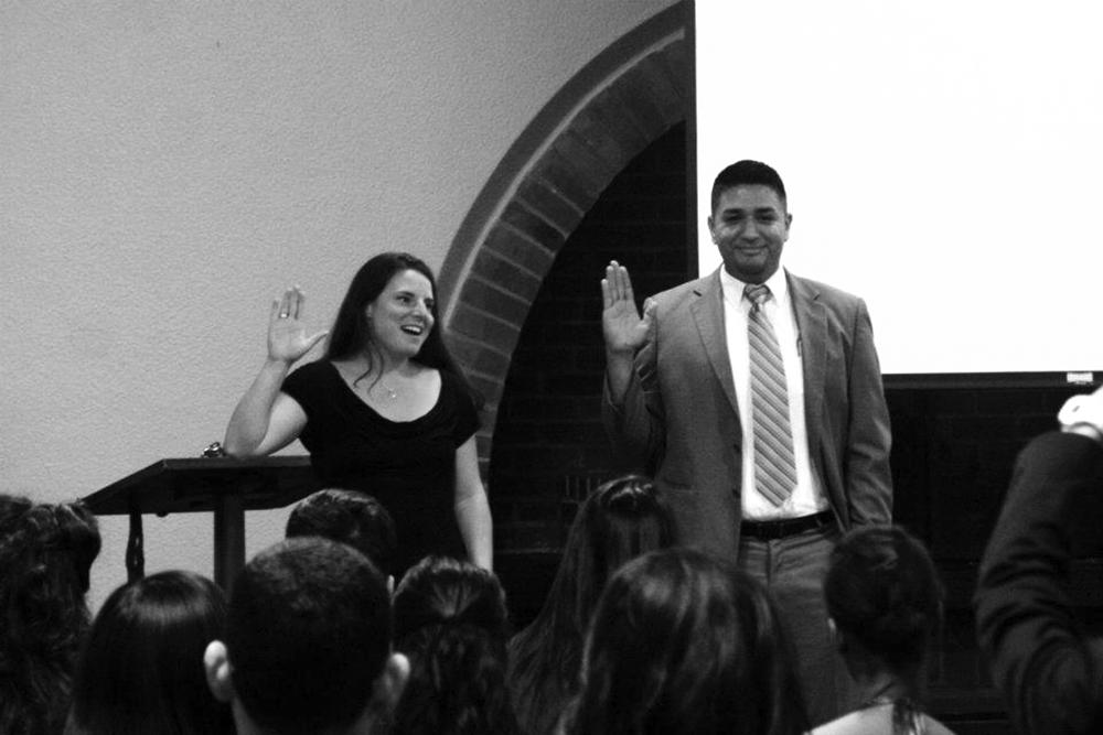 MAKING AN OATH - Last year’s student trusttee, Emily Kinner, participates in the inauguration of her successor, Vincent Mendoza, in from of the new DASB senate and student body members. The inauguration took place Tuesday June 5, in De Anza College’s fire side room in the Hinson Center.