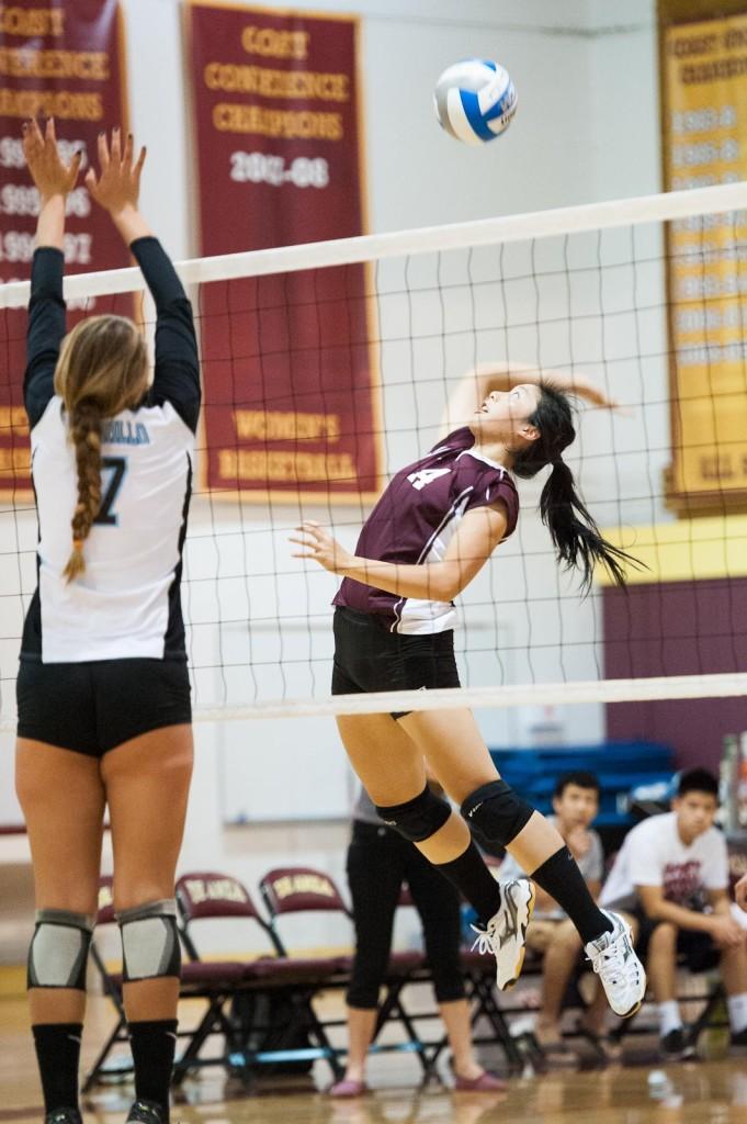 Sophmore Katherine Ja (14) spikes against Karly DaRosa of Cabrillo College during Wednesdays match at De Anza College