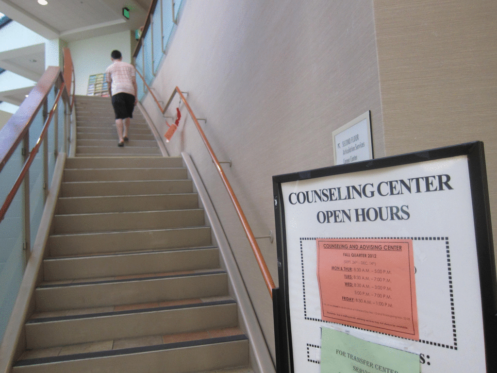 UPHILL BATTLE - Students may climb this staircase only to face longer lines if budget cuts to counseling continue