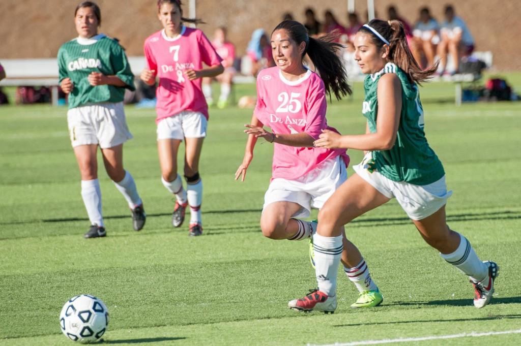 RUNNING ACROSS FIELD - The women’s soccer team beat opponents Cañada College Oct. 16