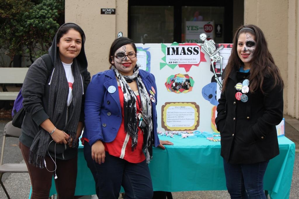 Members of the IMASS promote their club at the Club Expo while showing off sugar skull face paint.