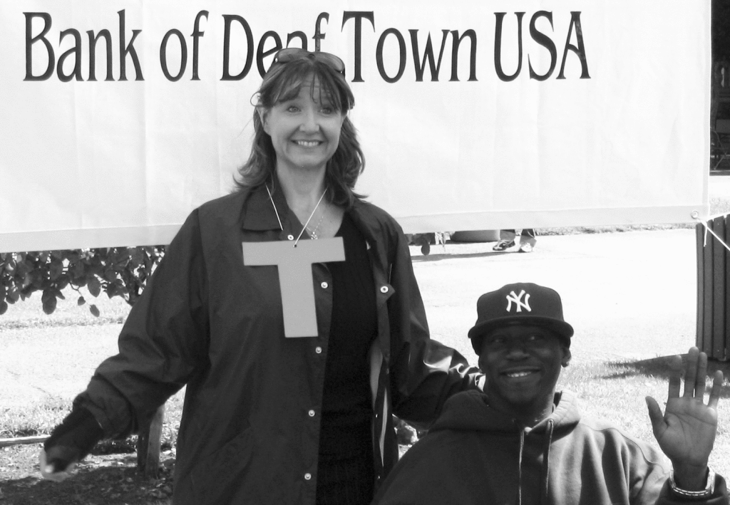 WHAT MADE HER HAPPY - Donna Bradshaw poses with a student in a Talk Police exercise during the 2010 Deaf Town event at De Anza College.
