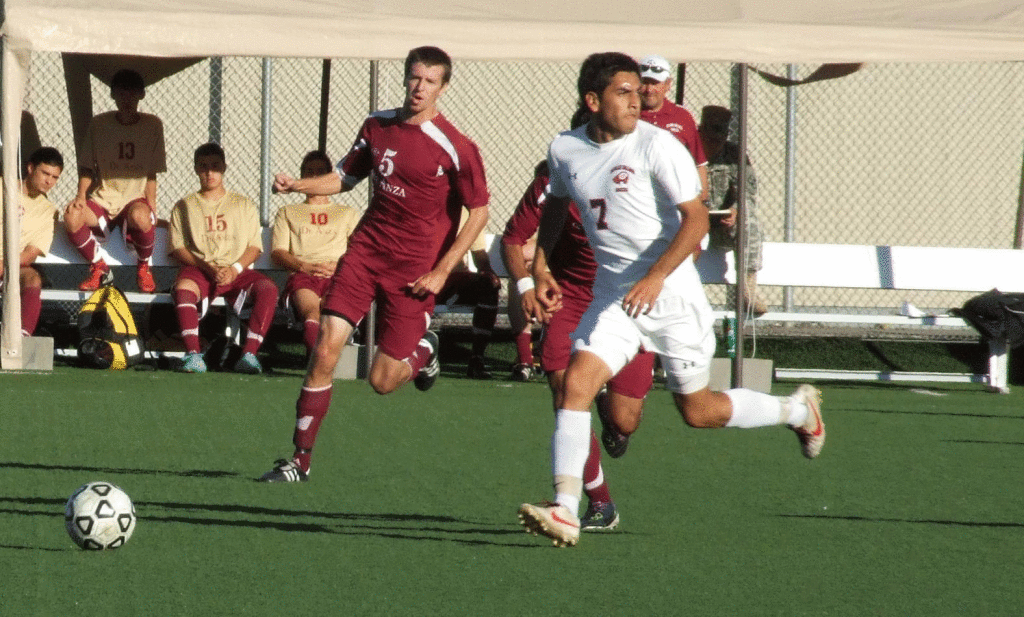 STEAL - De Anza midfielder Michael Kute (5) tries to come up and take the ball Gavilian forward Fabian Ruis (7) during their Oct. 26 match.