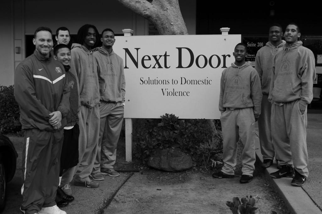 Change of pace- The Dons take a timeout from basketball to volunteer during the holidays.