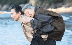 SHARED MOMENT -  The protagonist Kosaku Igami carries his senile mother during their time of reconciliation. The Harada film will run from Feb. 8 to Feb. 14 at the Bluelight Cinemas in the Oaks Shopping Center.