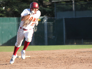 <p><b>Next Base</p></b>
Rey Gallegos clears second base and makes a run for third base during one of their regular season games.