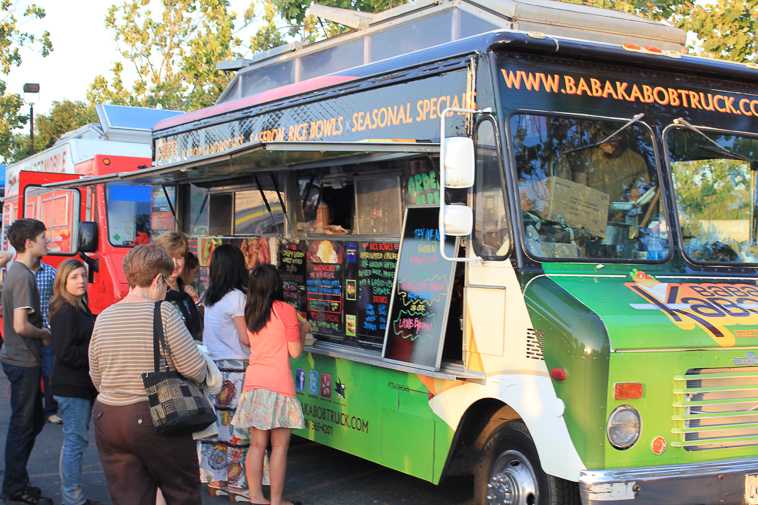 From Tacos to Rice Bowls
Customers line up in front of the Boba Kabob truck at Moveable Feast to order Persian styled concoctions. Friday May 3, 2013
