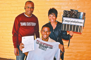 New Dustdevil
Denzel Copeland, 19, business administration, celebrates with his parents, hoisting his Texas A&M International sweatshirt.