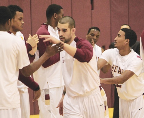 International Star
Basketball player Stefan Demirovic, 22, business administration, high fives his De Anza teammates before starting a game on Feb. 20.