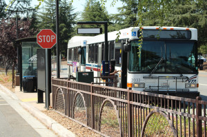 A student uses her Eco Pass to ride VTA transit for free.  Eco pass fees are included in student fees