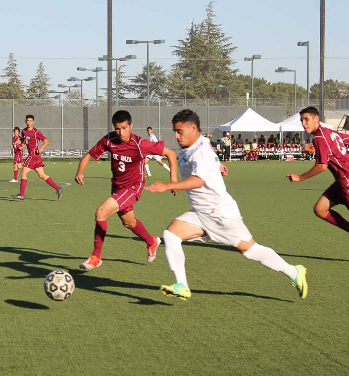 Jesus Joya (3) fighting an Ohlone College player for control of the ball Friday, Oct. 4.