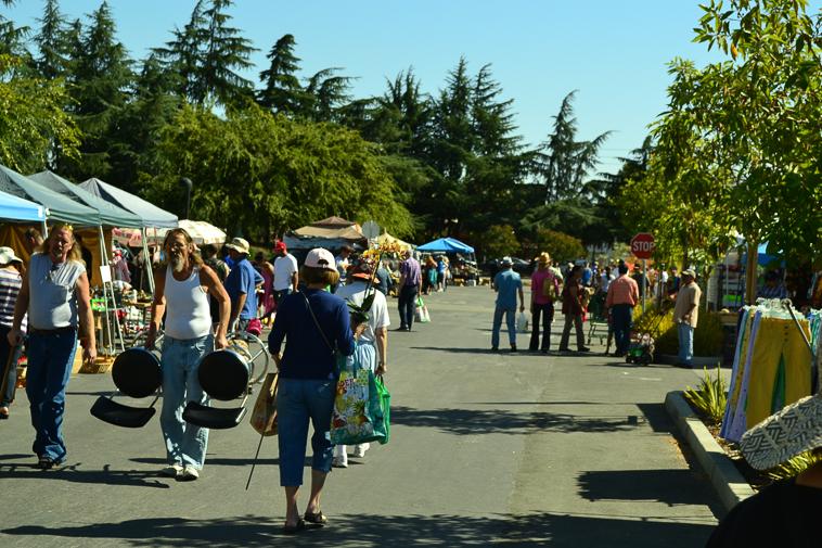 Shoppers walk along rows of vendors on Oct. 5, 2015 at the De Anza Flea Market. The market has since transitioned online. 