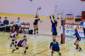Sophomore Julie Sam (2) takes a great leap to spike the ball into the opponent’s court