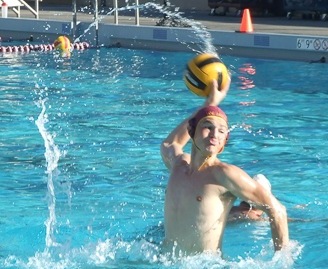 Leaping out of the water, sophomore Scott Reynolds winds up before attempting a shot on goal during practice Wednesday Nov. 6.