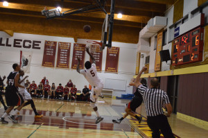 Sophomore Shaquille Gilbert (5) takes a shot after breaking away from a Foothill player Friday,Nov.13.