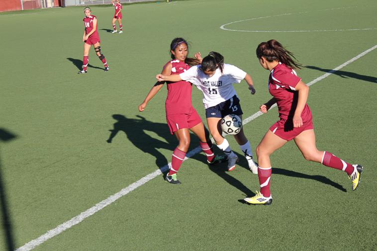 The Lady Dons of the women’s soccer team play hard defense as they try to stop the West Valley forward from advancing into their territory Tuesday, Nov. 5.