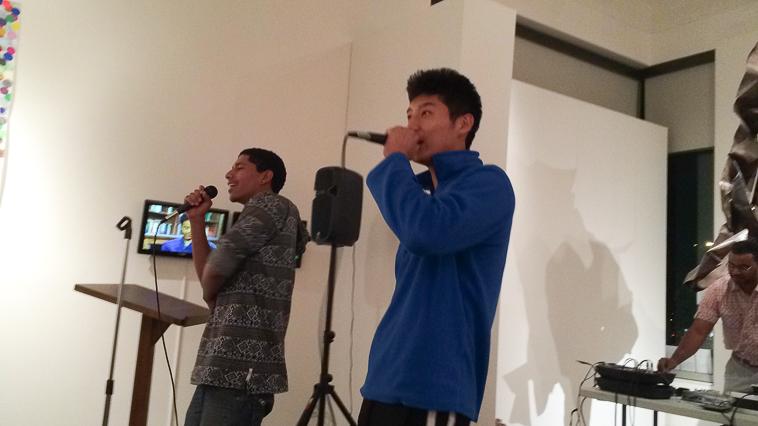 Davied Morales, left, and Chuck Lee, right, sing and perform rap.
