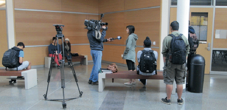 De Anza students talk to a cameraman from KPIX 5, who identified himself as Ed, in the MLC Friday Nov. 8.