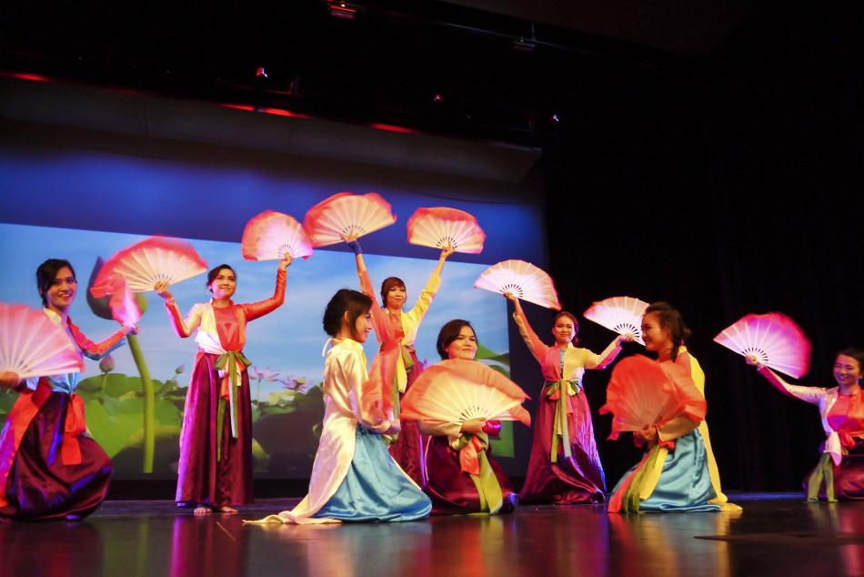 Members of the Vietnamese Student Association perform a traditional Vietnamese group dance in the Visual and Performing Arts Center. 