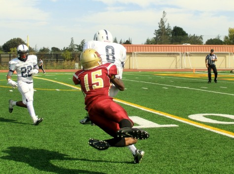 A pass intended for De Anza sophomore wide receiver James Roe (15) is intercepted by American River defensive back Malcolm Scott (8). The Dons lost their home opener 49-28 on Saturday Sept. 13.
