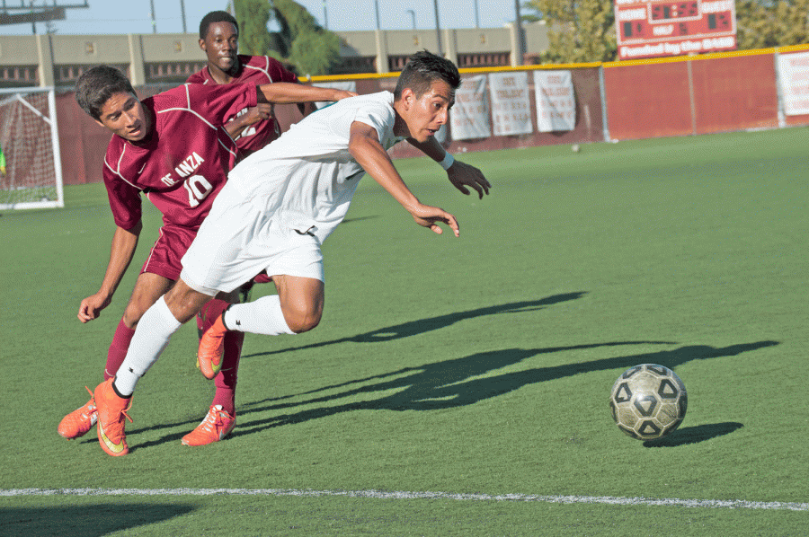 Midfielder Roberto Mendoza (10) steals the ball from a Lake Tahoe player sending him stumbling in the process.
