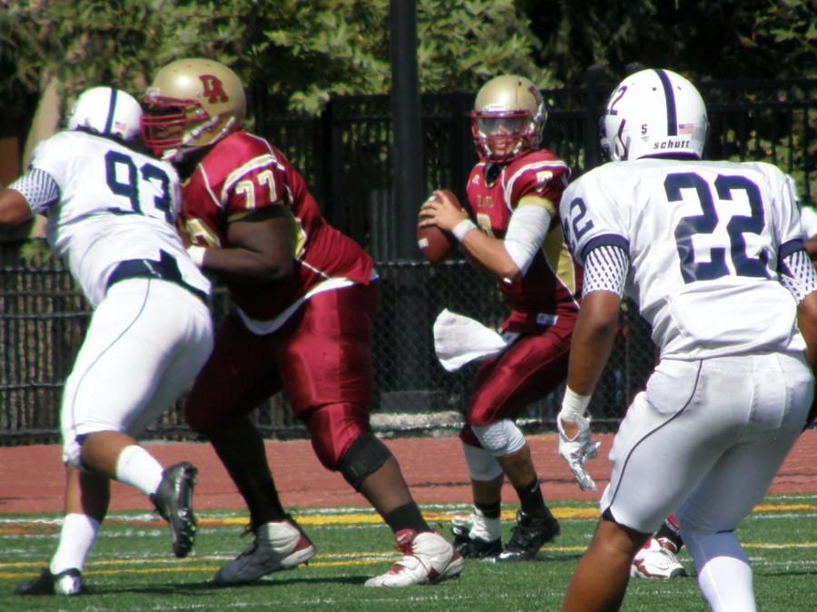 Sophomore quarterback TJ Menning (7) surveys the field and attempts to find an open receiver.
