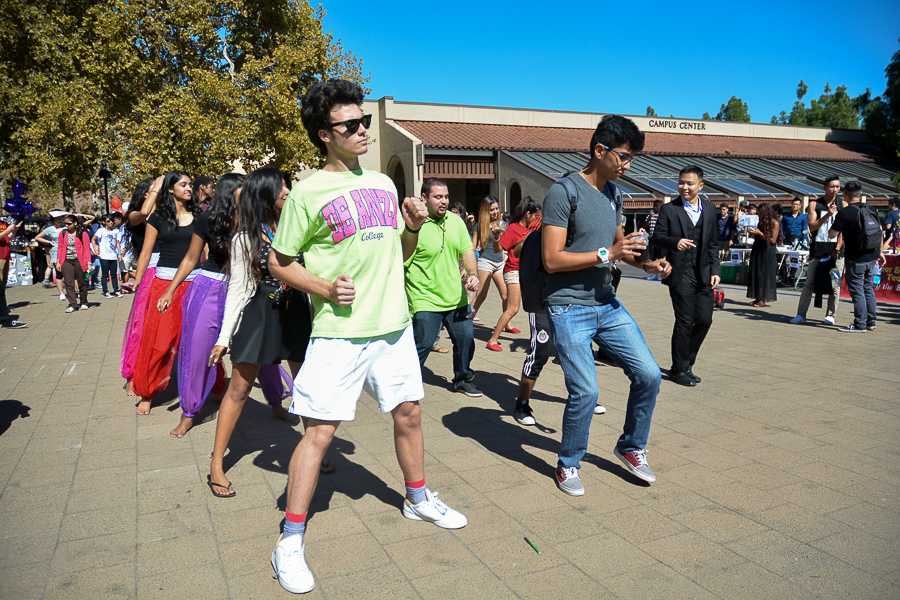 Students from different clubs join together during an impromptu dance in the main quad during club day on Thursday Oct. 9.