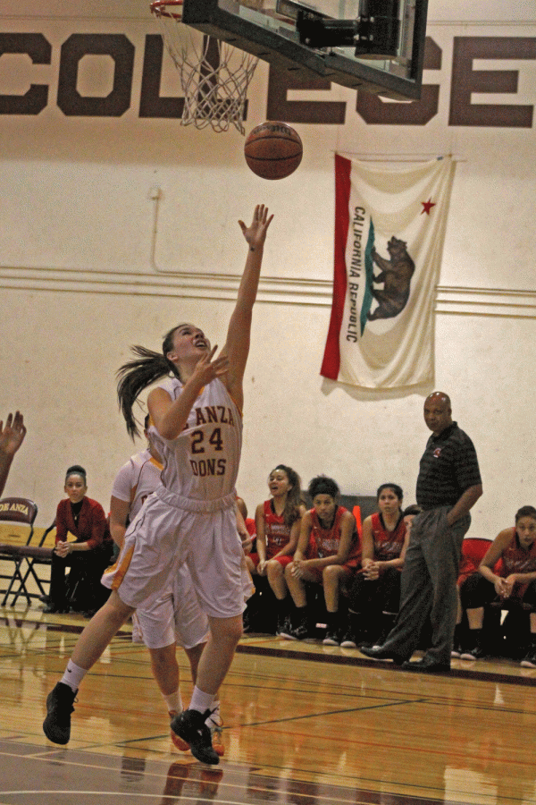 Dons’ freshman forward Corie Stocker (24) runs down an open court and goes for a quick lay-up. De Anza lost by two points on Tuesday Nov. 4.