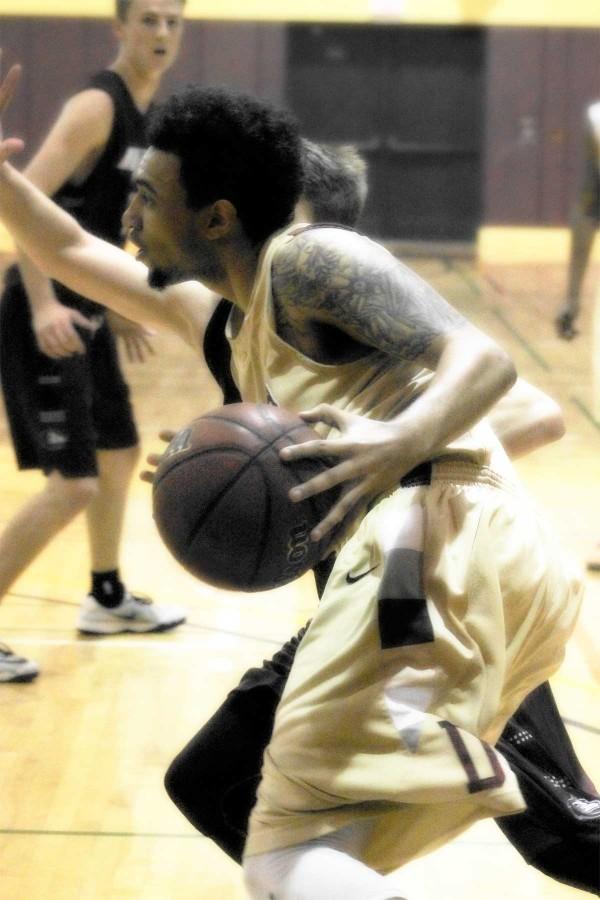 Sophomore guard Kyle Connor (15) drives for the shot as the Dons lost to the visiting Lobos Jan. 30 at De Anza College.