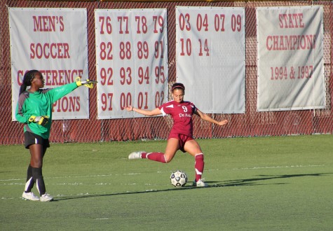 Defender Celena Velasquez performs a set piece play while goalie Sena Harlley directs the defense during the Dons’ 4-0 loss to Ohlone College.