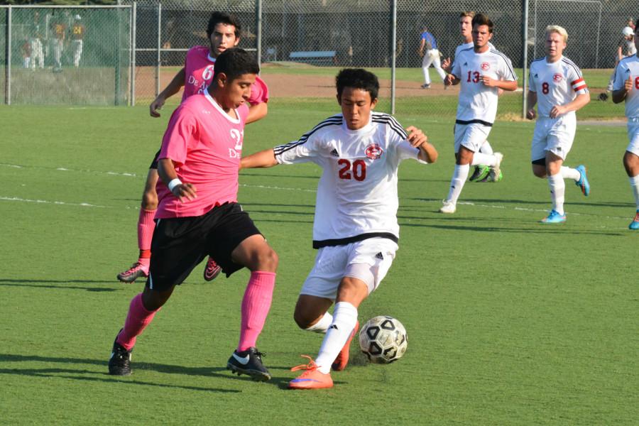 De Anza Forward Alfredo Tinoco (21) fights for the ball in the Dons match against Foothill College on Wednesday Oct. 13. 