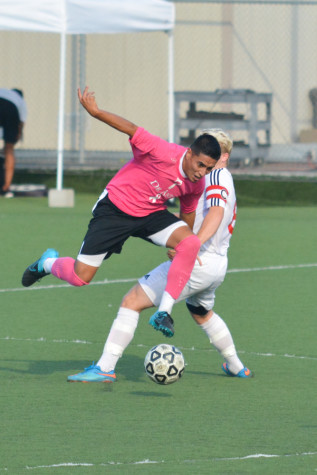 Forward Miguel Castillo (7) battles for possession against a Foothill College defender in their 1-1 draw on Tuesday Oct. 13.