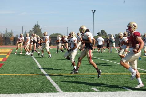 The Dons run warmup drills during practice. The Dons fierce defense forced four turnovers in their 24-14 win over Laney. 