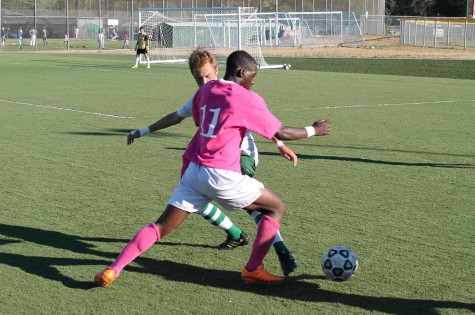 De Anza forward Sahr Mattia runs through a Canada College defender during the Dons' match against the Canada College Colts on Friday Oct. 9. 