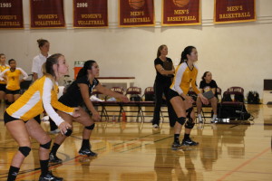 The De Anza Volleyball team, led by team captain and outside hitter Amelya Vu (9), get set for an Ohlone serve in their loss (25-17, 25-18, 25-17) to the Ohlone College Renegades. 