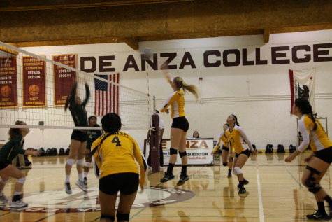 De Anza Middle blocker Anna Craig (1) spikes the ball during the Dons' match against Ohlone College on Friday Oct. 3. 